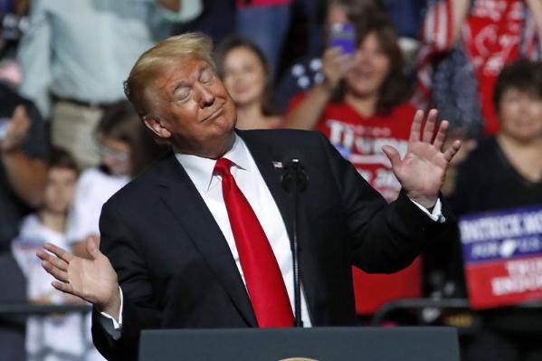 President Donald Trump reacts to the playing of West Virginia’s state song as he takes the stage during a rally in Wheeling, W.Va., Saturday, Sept. 29, 2018. [Photo: AP/Gene J. Puskar]
